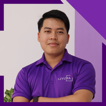 A man wearing a purple shirt that says levera