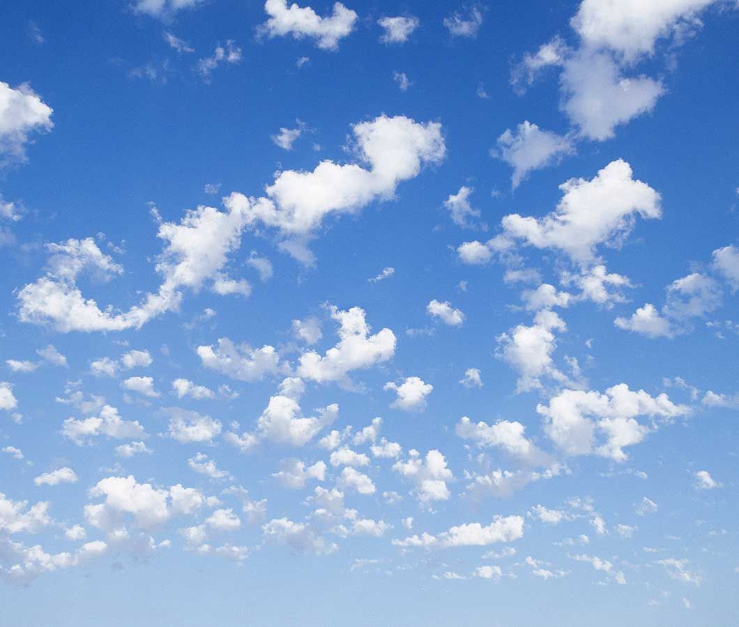 A blue sky with white clouds in it