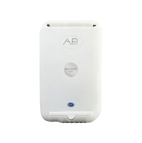 A white device that looks like a cell phone is sitting on a white surface.