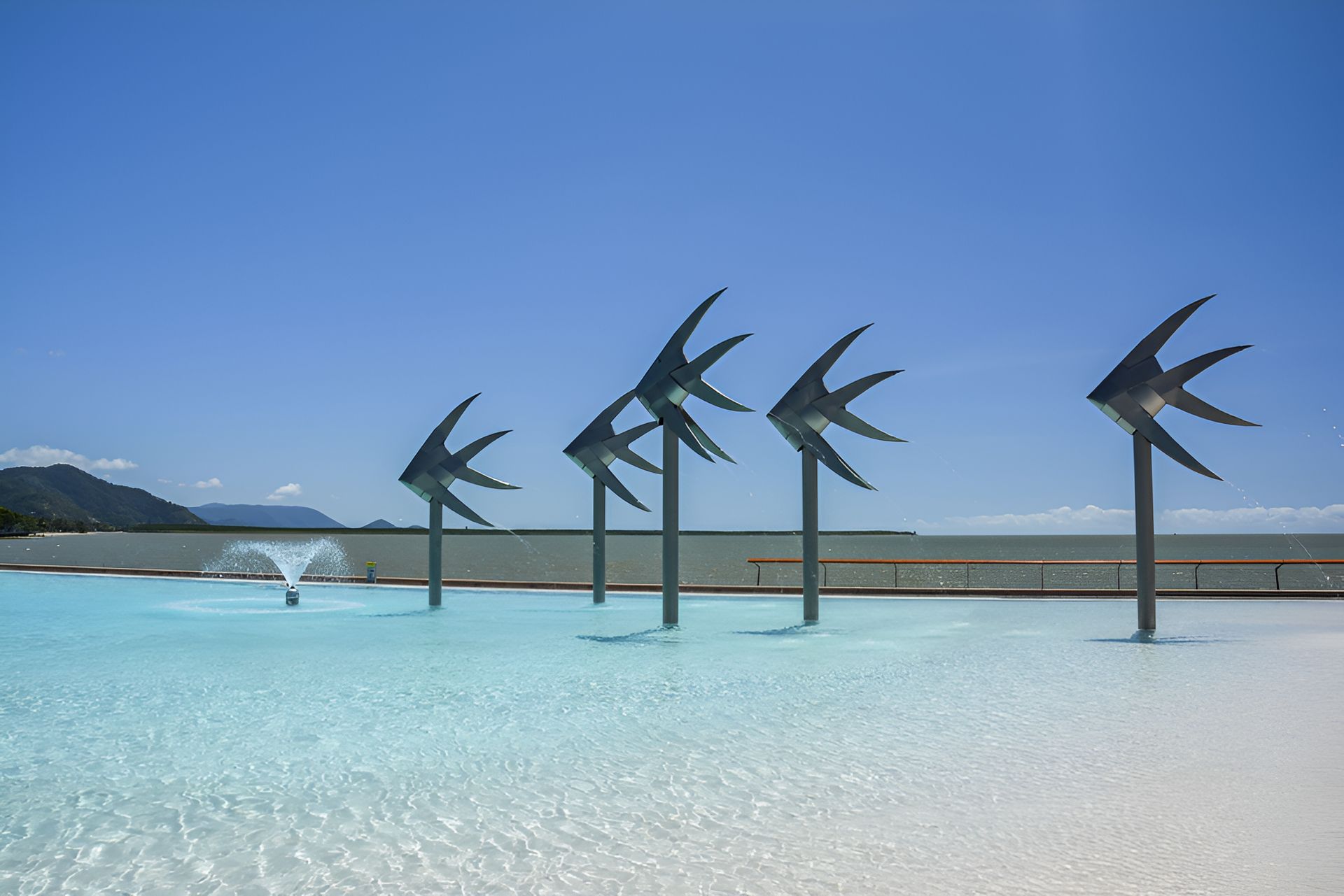 A Swimming Pool With A Fountain In The Middle Of It — Barcou Electrics In Gordonvale, QLD