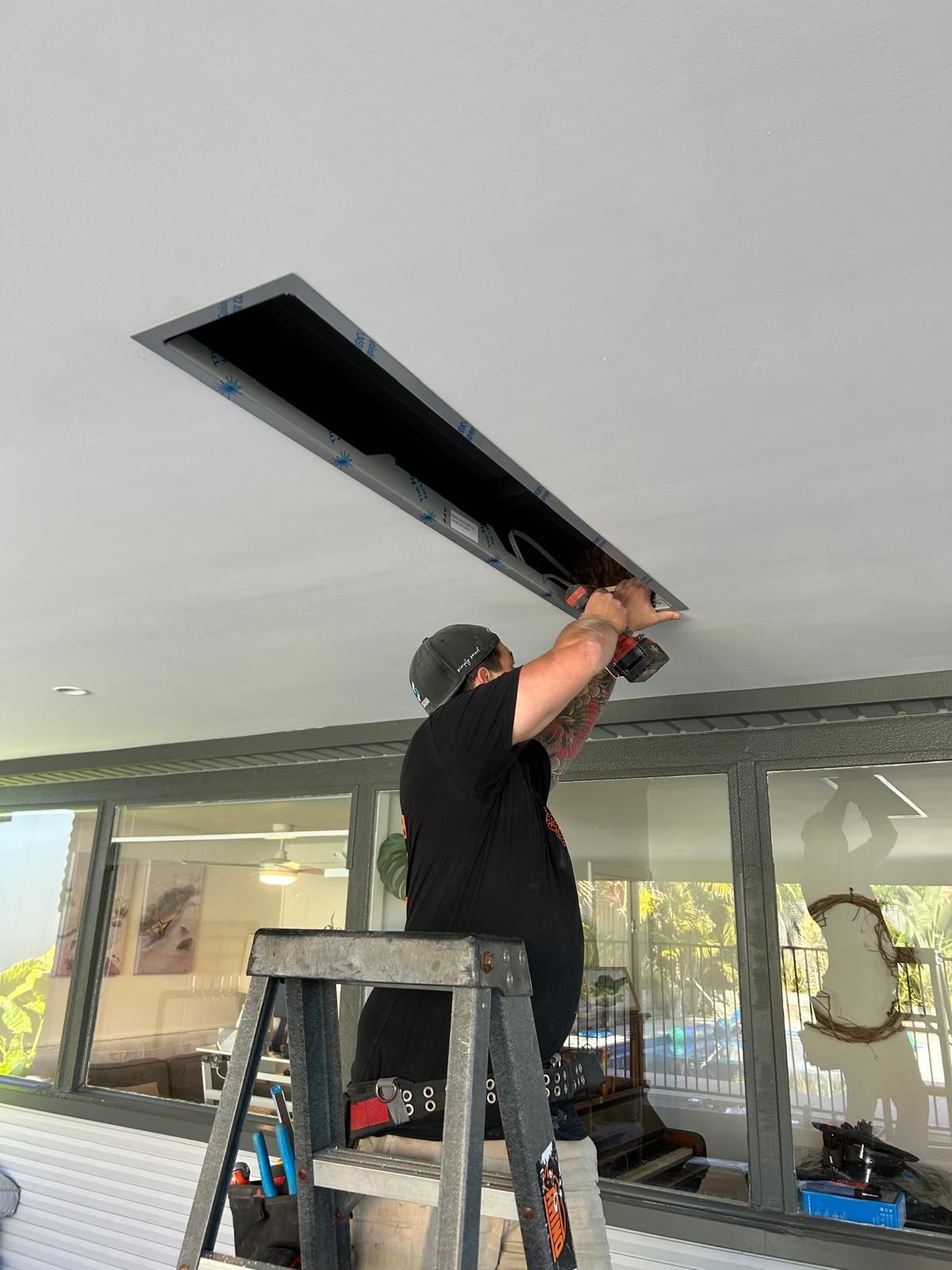 Roof light fixture being fitted -Mylec Electrical Solutions in Shell Cove, NSW