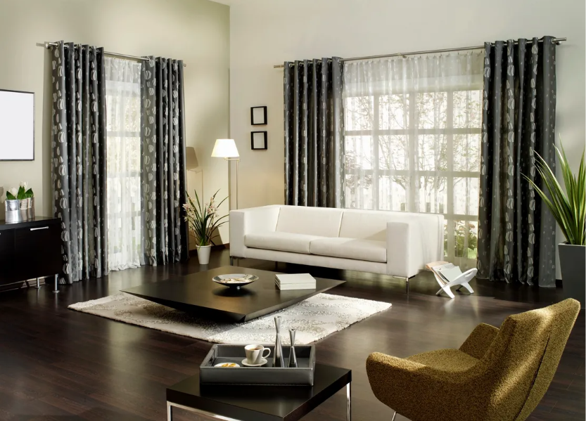 A living room with a white couch and a black coffee table