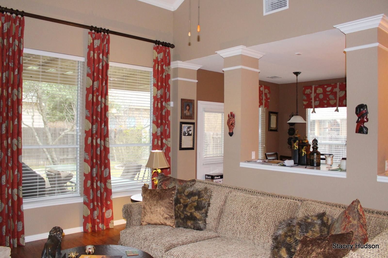 A living room with a couch and lots of windows