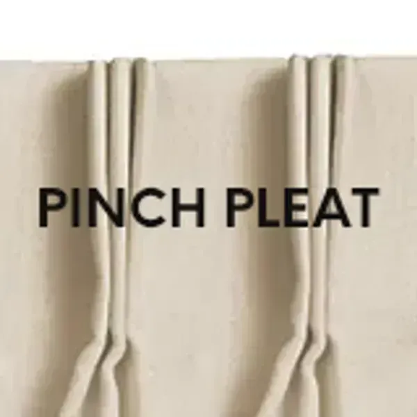 A close up of a pinch pleat curtain on a white background.