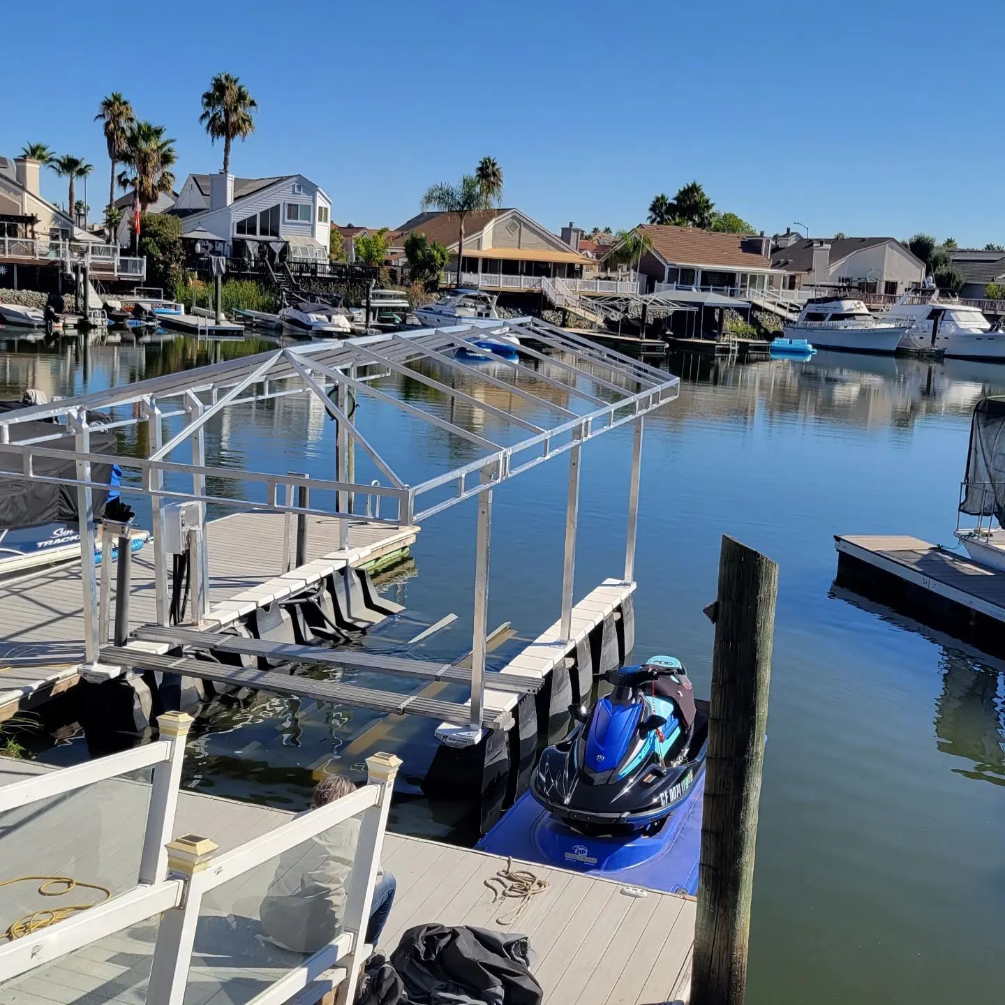 A jet ski is docked at a dock in a marina