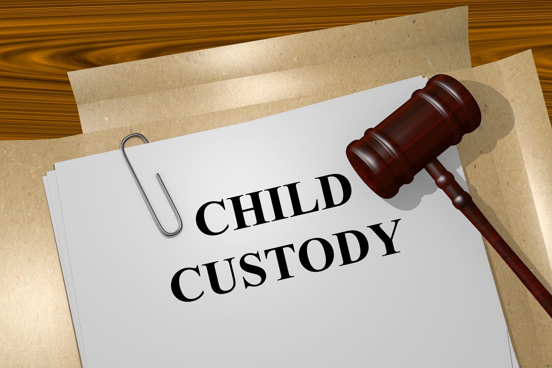 Child custody documents with a judge’s gavel on a desk. Child custody documents with a judge’s gavel on a desk.
