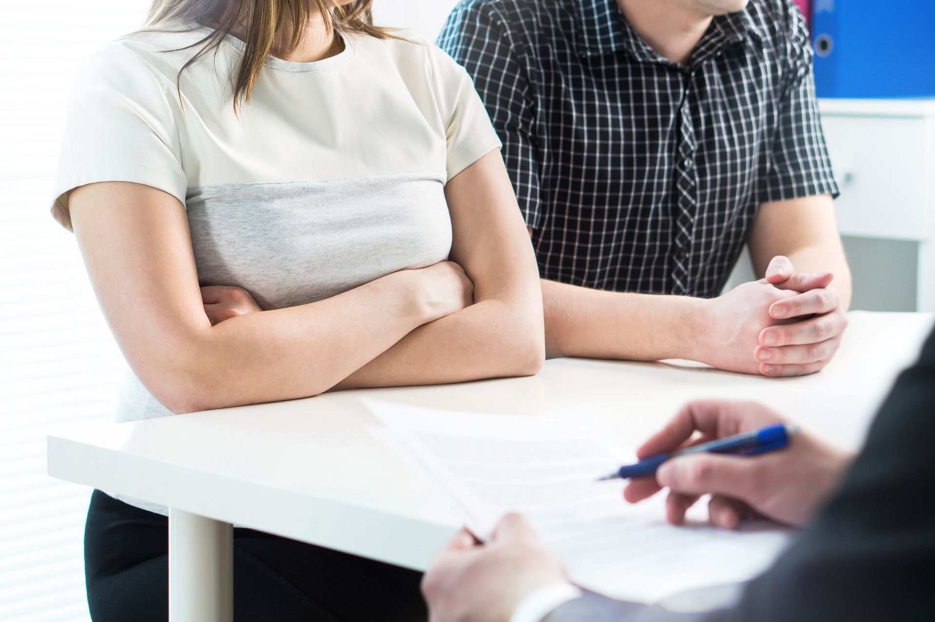 A couple in a meeting with a child custody lawyer.