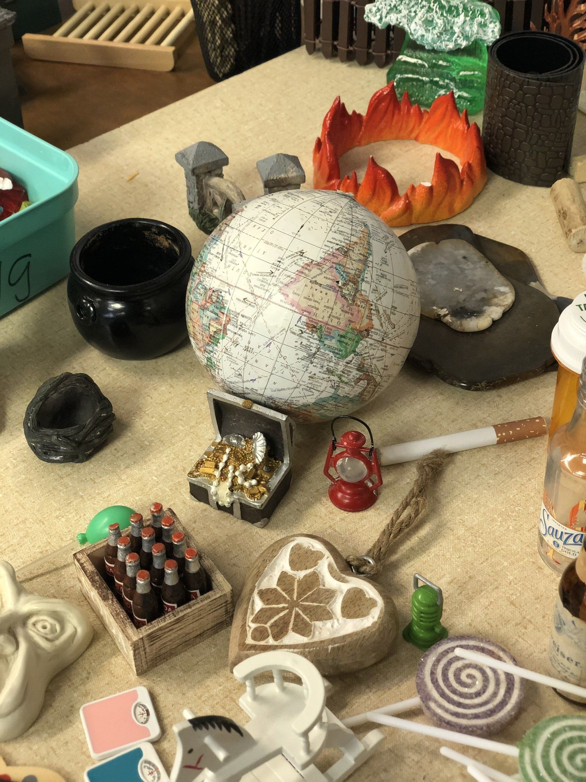 A table with a globe and other items on it