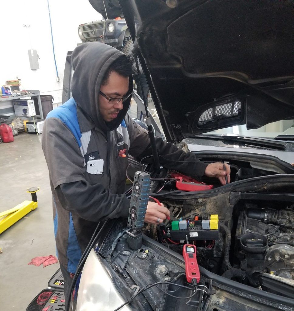 Eric performing car maintenance | Oscar's Automotive
