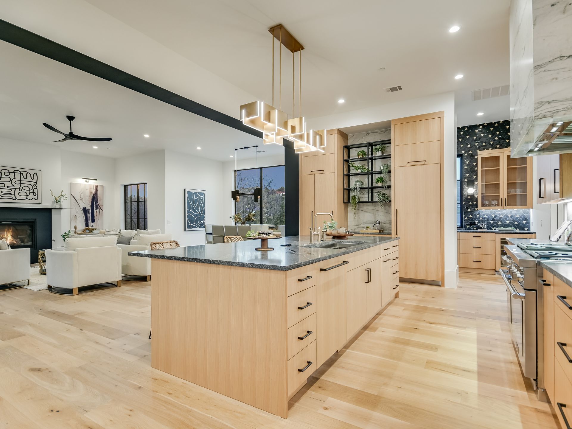 A kitchen with a large island and stainless steel appliances