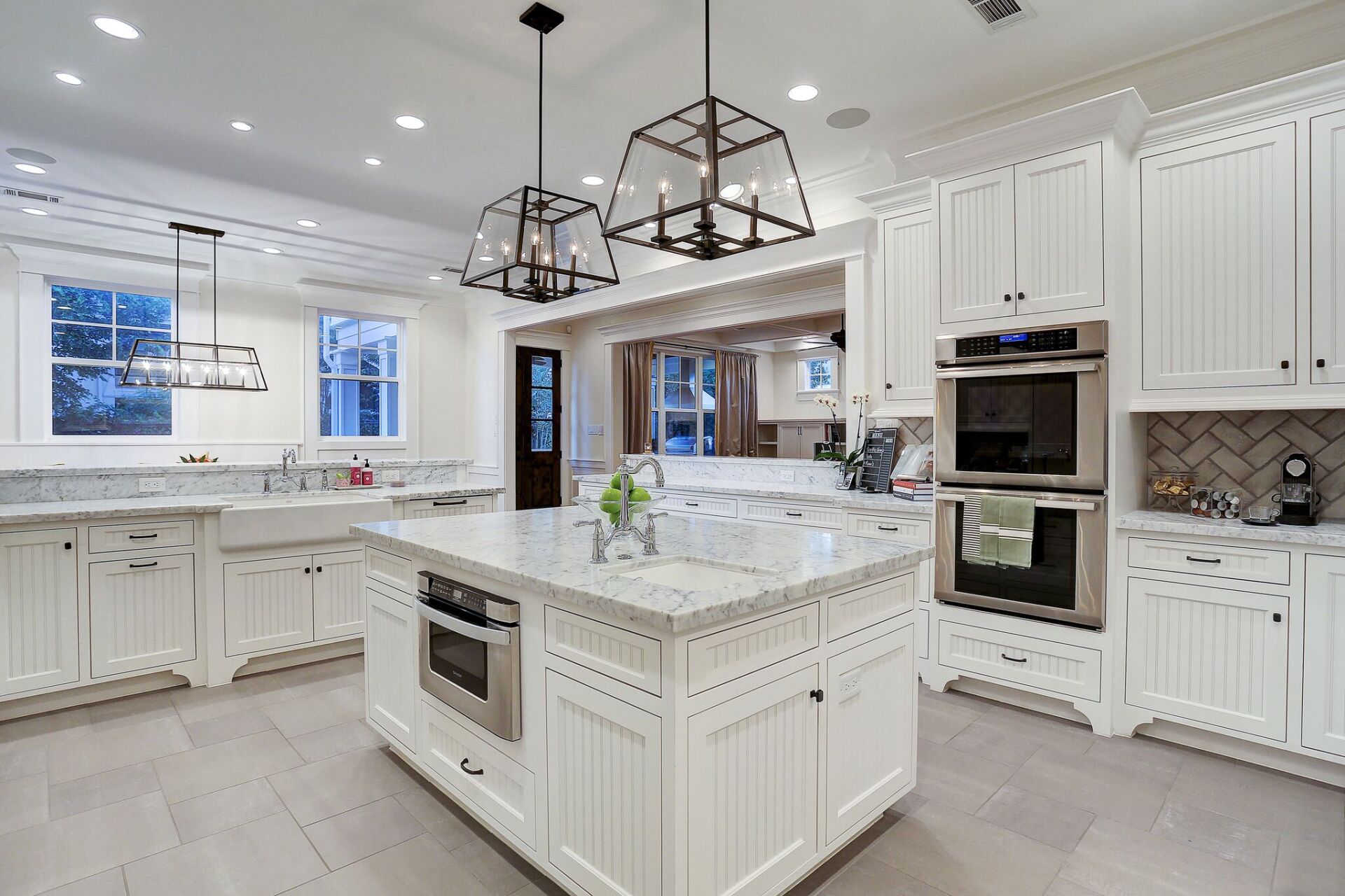 There is a large island in the middle of the kitchen.