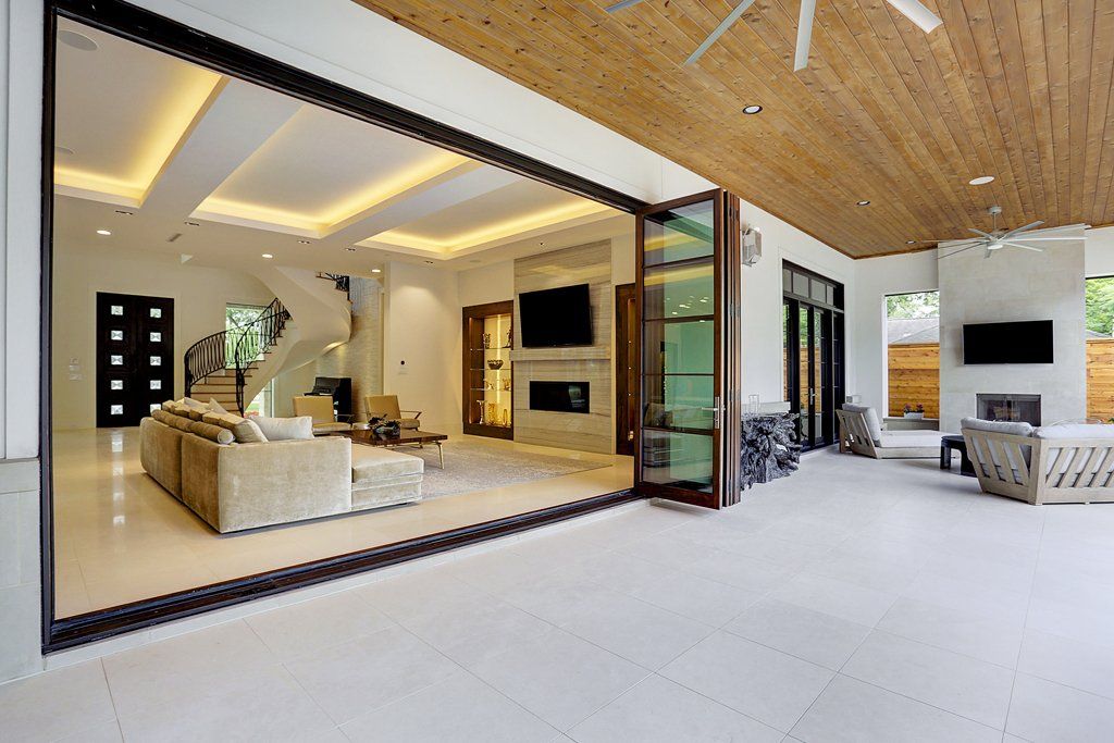 A living room with sliding glass doors leading to a patio.