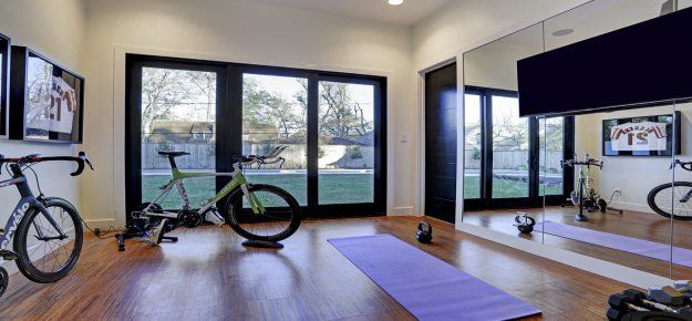 There is a bicycle in the middle of the room.