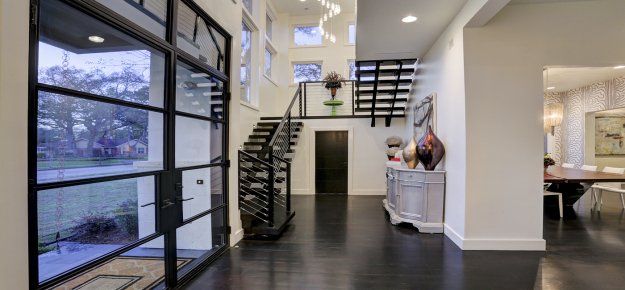 There is a staircase in the middle of the hallway.