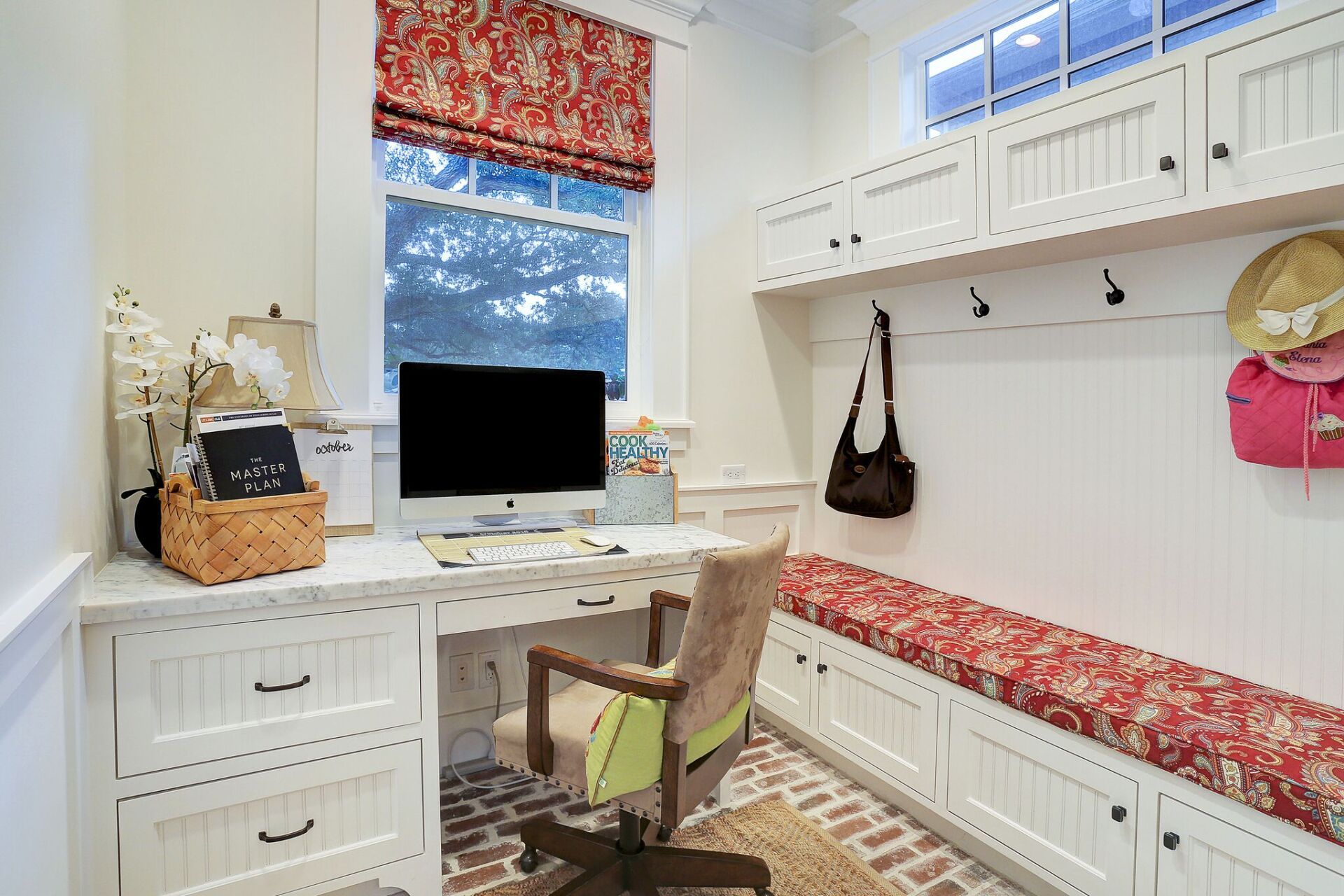 A home office with a desk , chair , and computer.