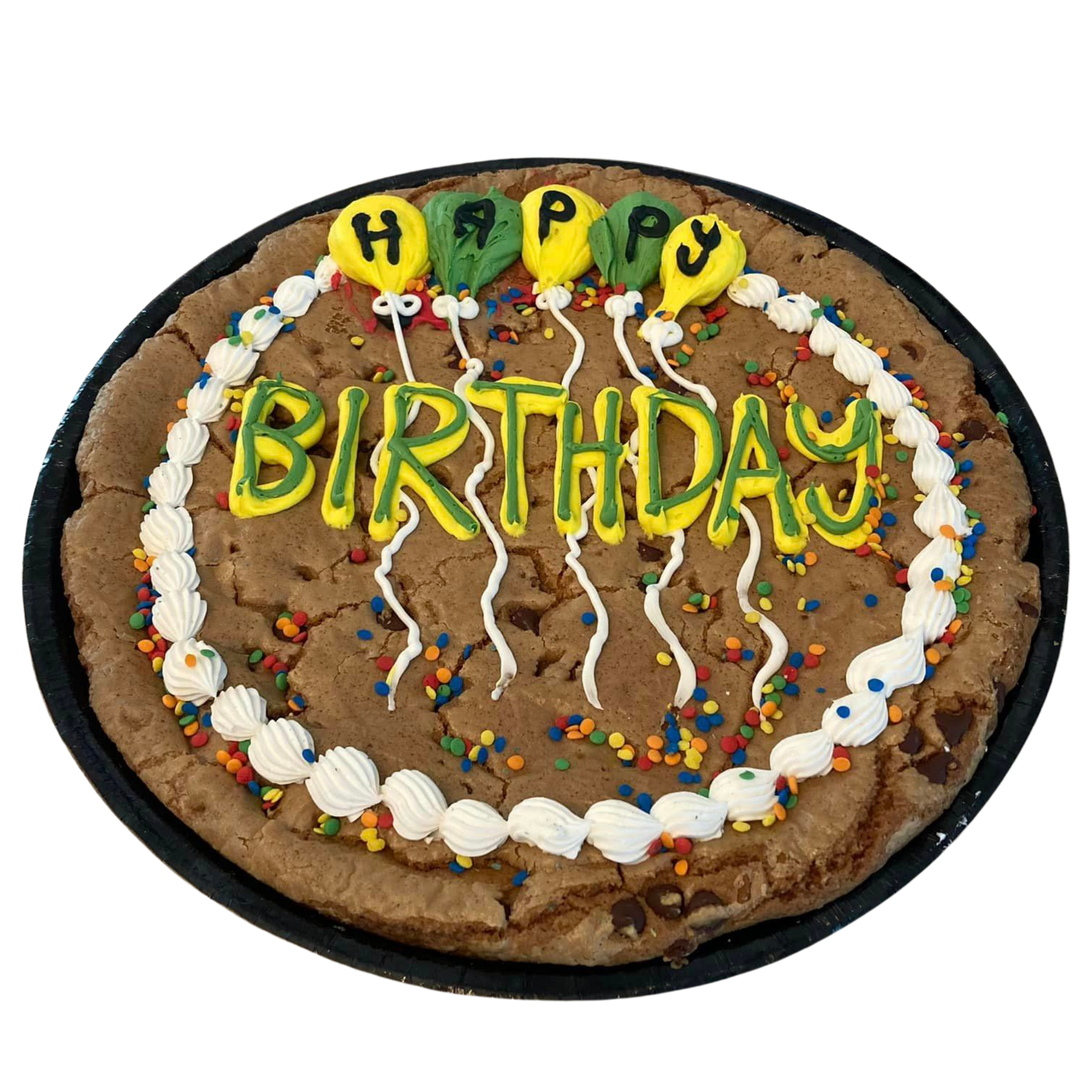 Birthday cookie cake with yellow lettering, white frosting border, and colorful sprinkles on a black tray