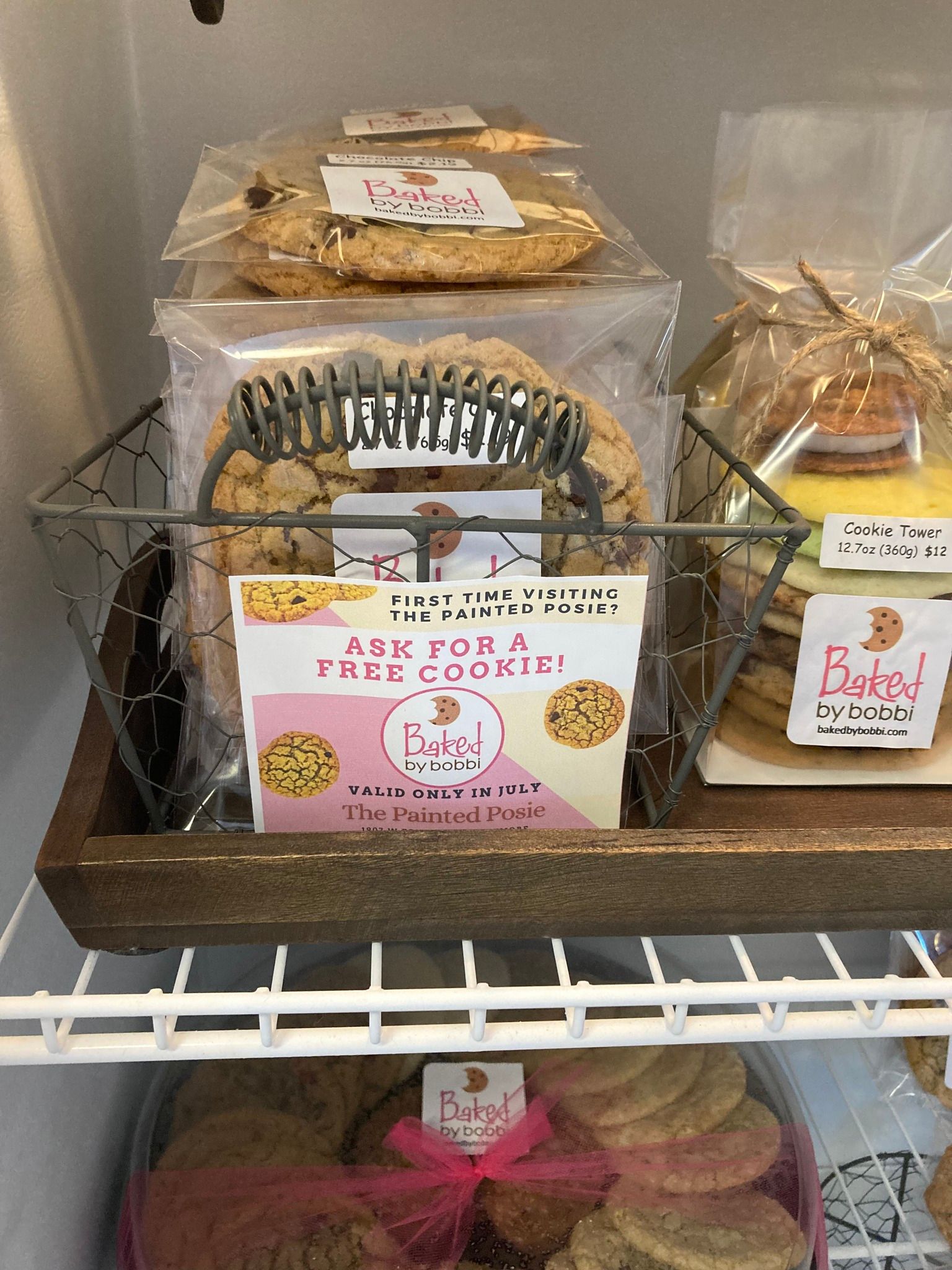 A basket of cookies is sitting on top of a shelf.
