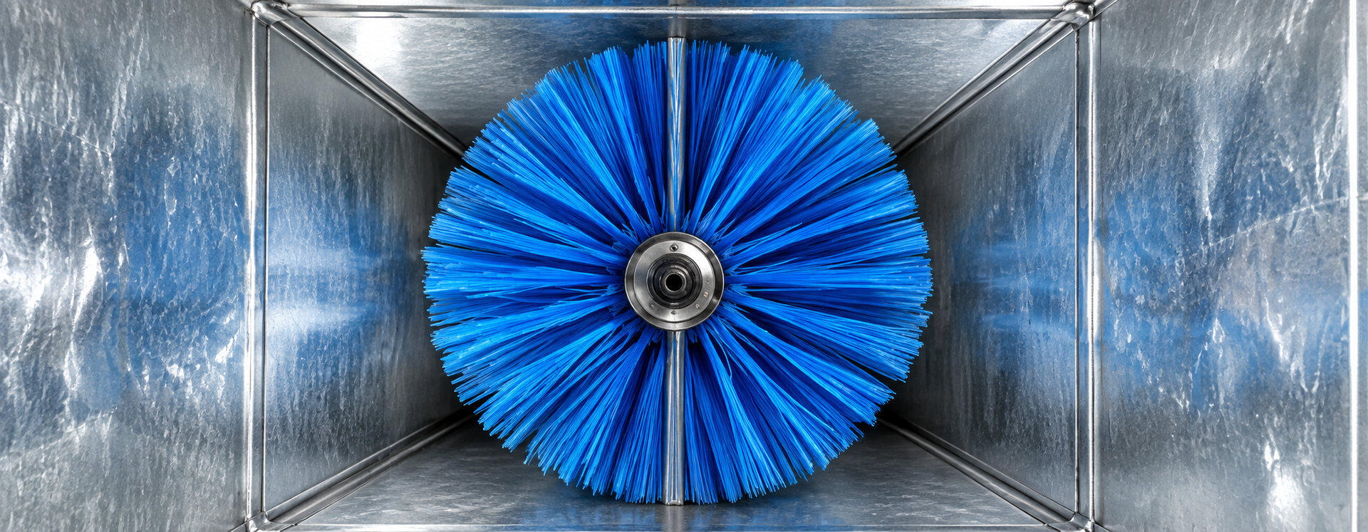 Blue circular turbine fan centered in a metallic square duct