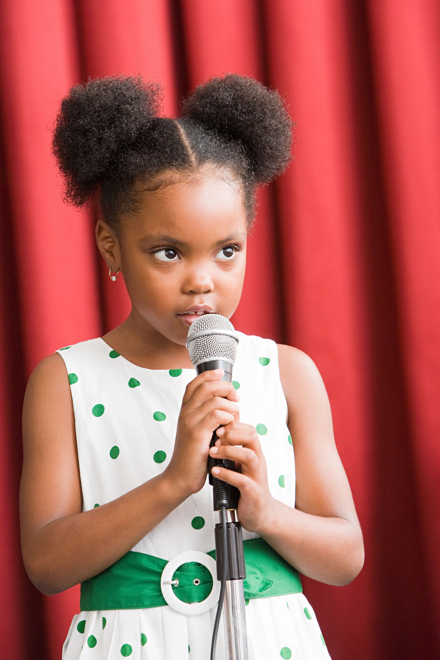 Girl holding a microphone with red background - Georgia, USA - Soundscapes School of Music Girl holding a microphone with red background - Georgia, USA - Soundscapes School of Music
