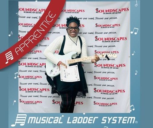 Auria earned her certificate and wristband for 3 months of electric guitar lessons! Auria earned her certificate and wristband for 3 months of electric guitar lessons!