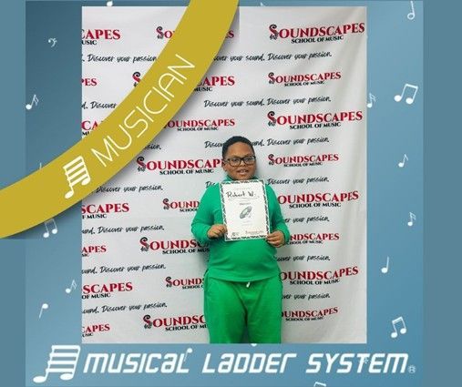 Robert earned his certificate and wristband for 9 months of piano lessons! Robert earned his certificate and wristband for 9 months of piano lessons!