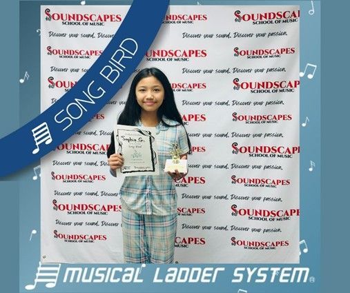 Sophia earned her certificate, wristband, and trophy for 6 months of voice lessons! Sophia earned her certificate, wristband, and trophy for 6 months of voice lessons!