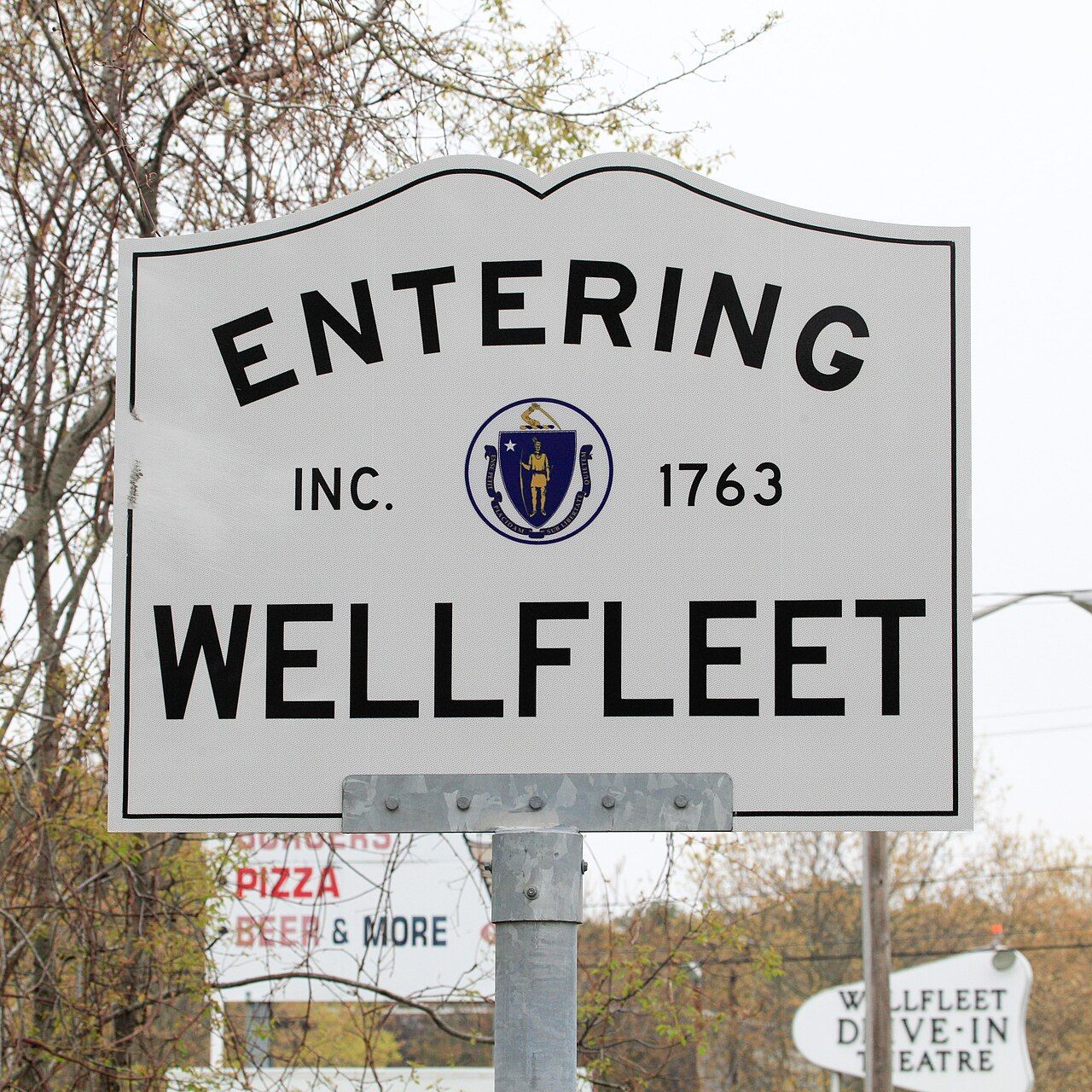 A white sign that reads