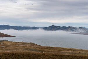 A view of fog traveling across the surface of Lake Oroville near the Oroville Dam, in Butte County, California. On this date, the water storage was 2,008,215 acre-feet (AF), 59 percent of the total capacity. Photo taken December 20, 2024.Picture