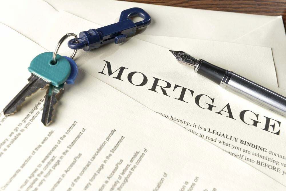 Mortgage Document With Keys and a Pen on a White Desk — MoneySmith Group In Kingscliff, NSW