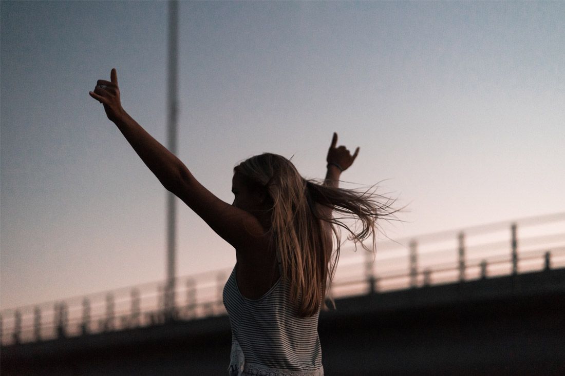 A Woman is Standing on a Bridge — MoneySmith Group In Kingscliff, NSW