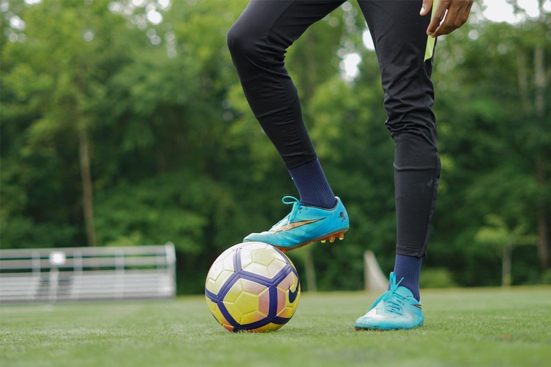 A Person is Kicking a Soccer Ball on a Field — MoneySmith Group In Kingscliff, NSW