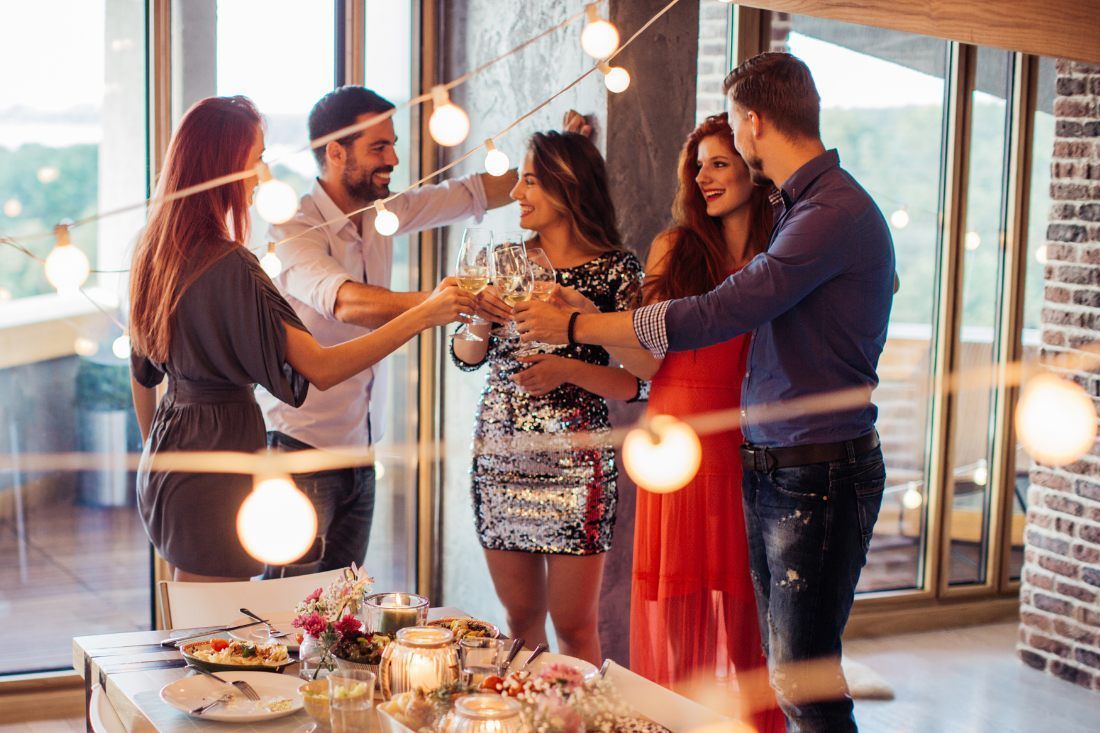 A Group of People Are Standing Around a Table — MoneySmith Group In Kingscliff, NSW