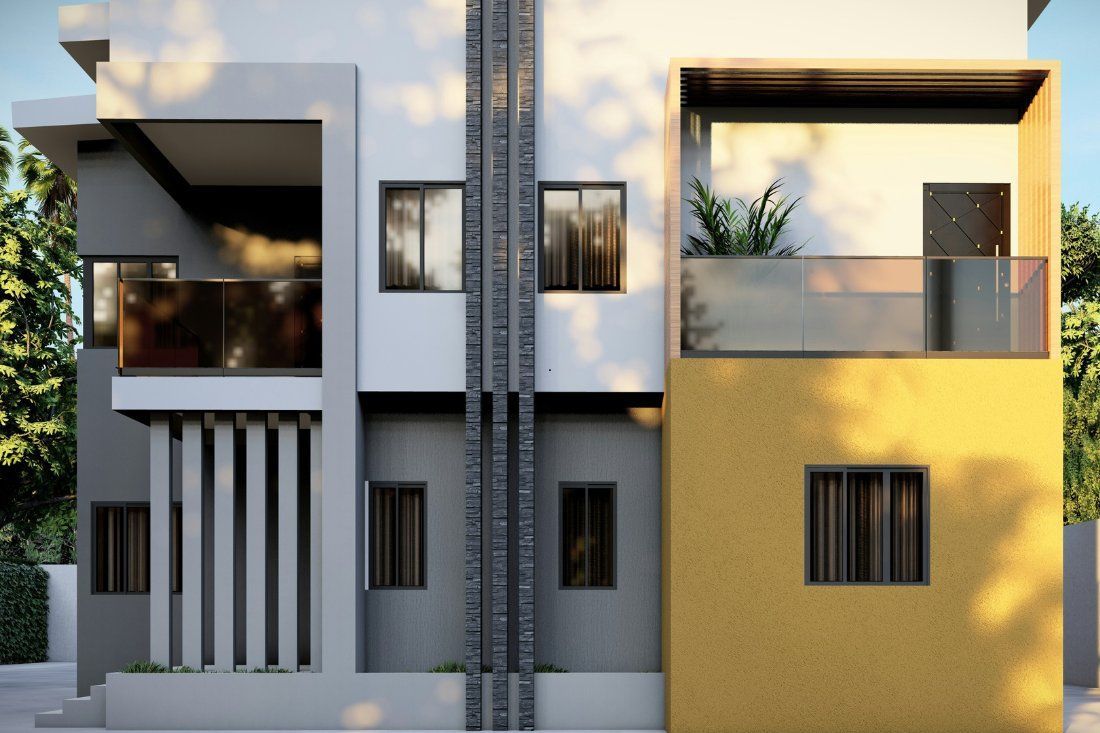 A modern two-story home exterior with gray and yellow walls, balconies with glass railings, and vertical stone accents.