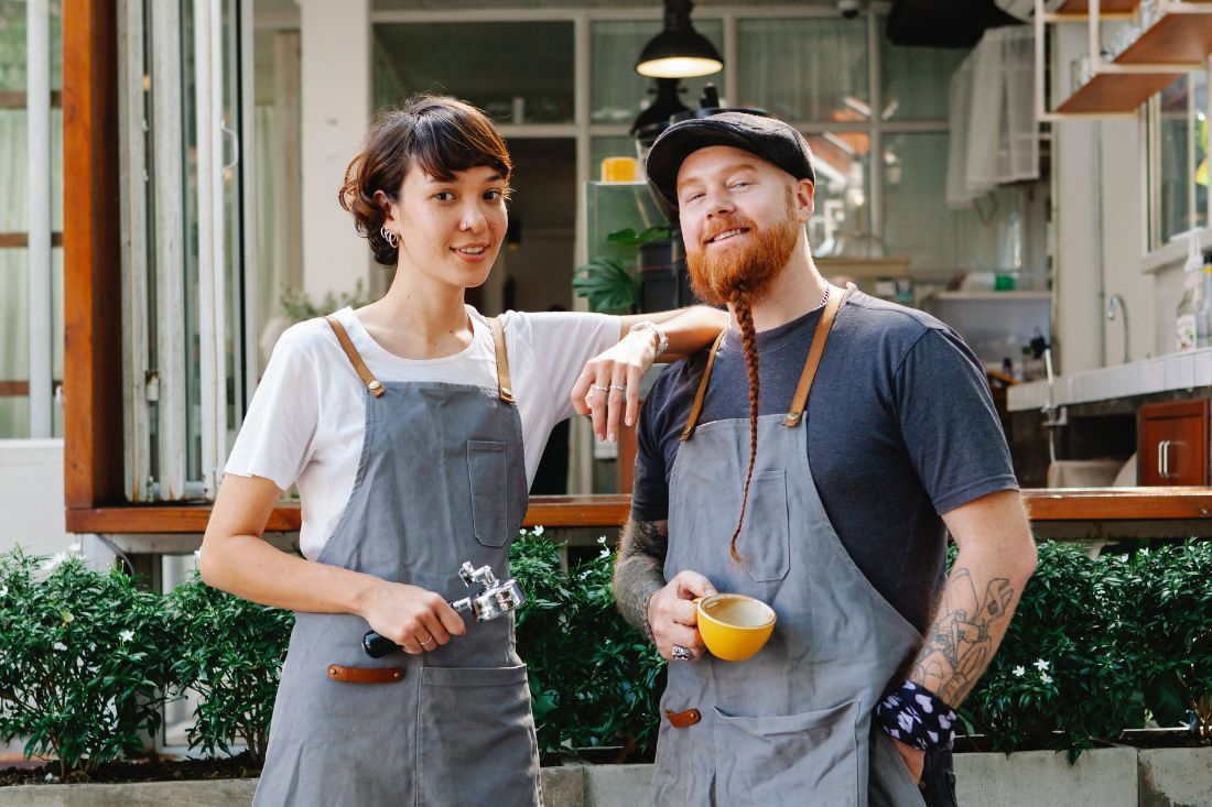 A Man and a Woman Are Standing Next to Each Other — MoneySmith Group In Kingscliff, NSW