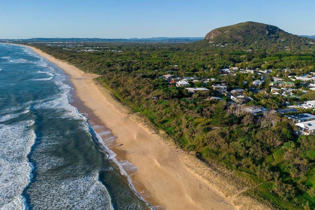 An Aerial View of a Beach With a Mountain — MoneySmith Group In Kingscliff, NSW