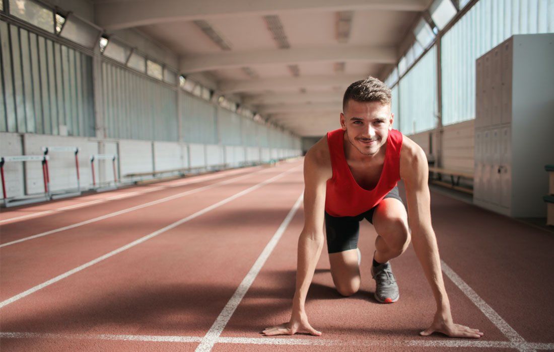 A Man is Getting Ready to Run on a Track — MoneySmith Group In Kingscliff, NSW