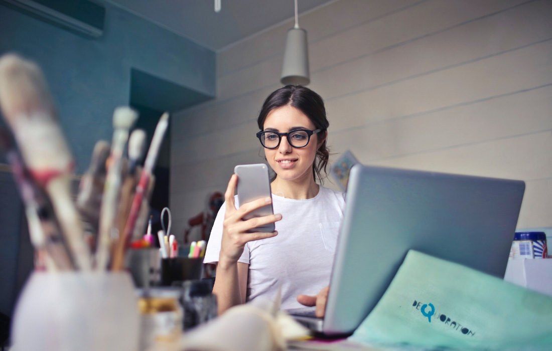 A Woman is Sitting at a Desk — MoneySmith Group In Kingscliff, NSW