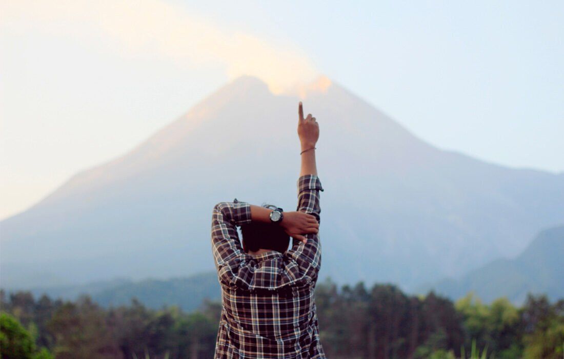 Man is Standing in Front of a Mountain — MoneySmith Group In Kingscliff, NSW
