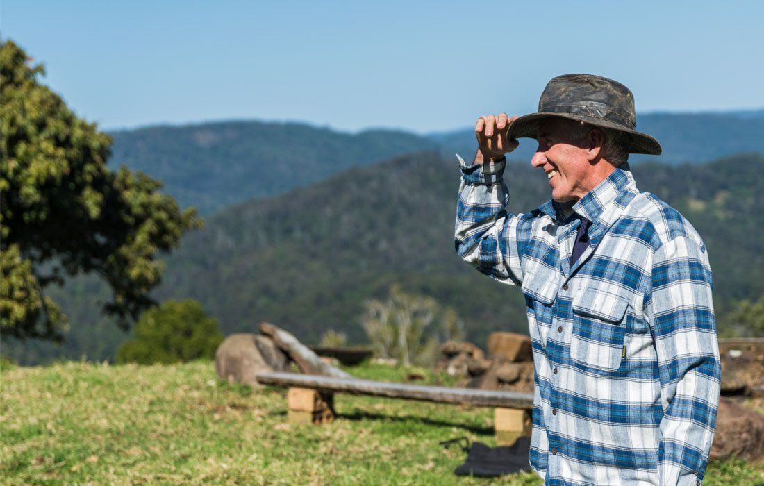 A Man in a Plaid Shirt — MoneySmith Group In Kingscliff, NSW
