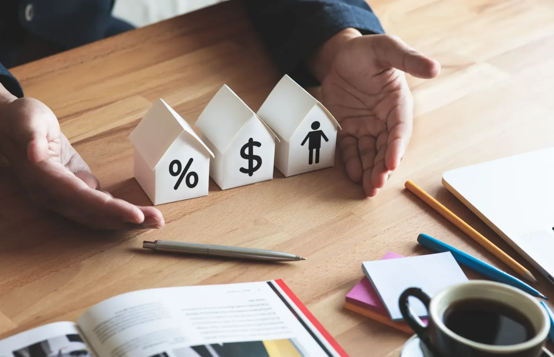 Hands Holding Small House-shaped Cards — MoneySmith Group In Kingscliff, NSW
