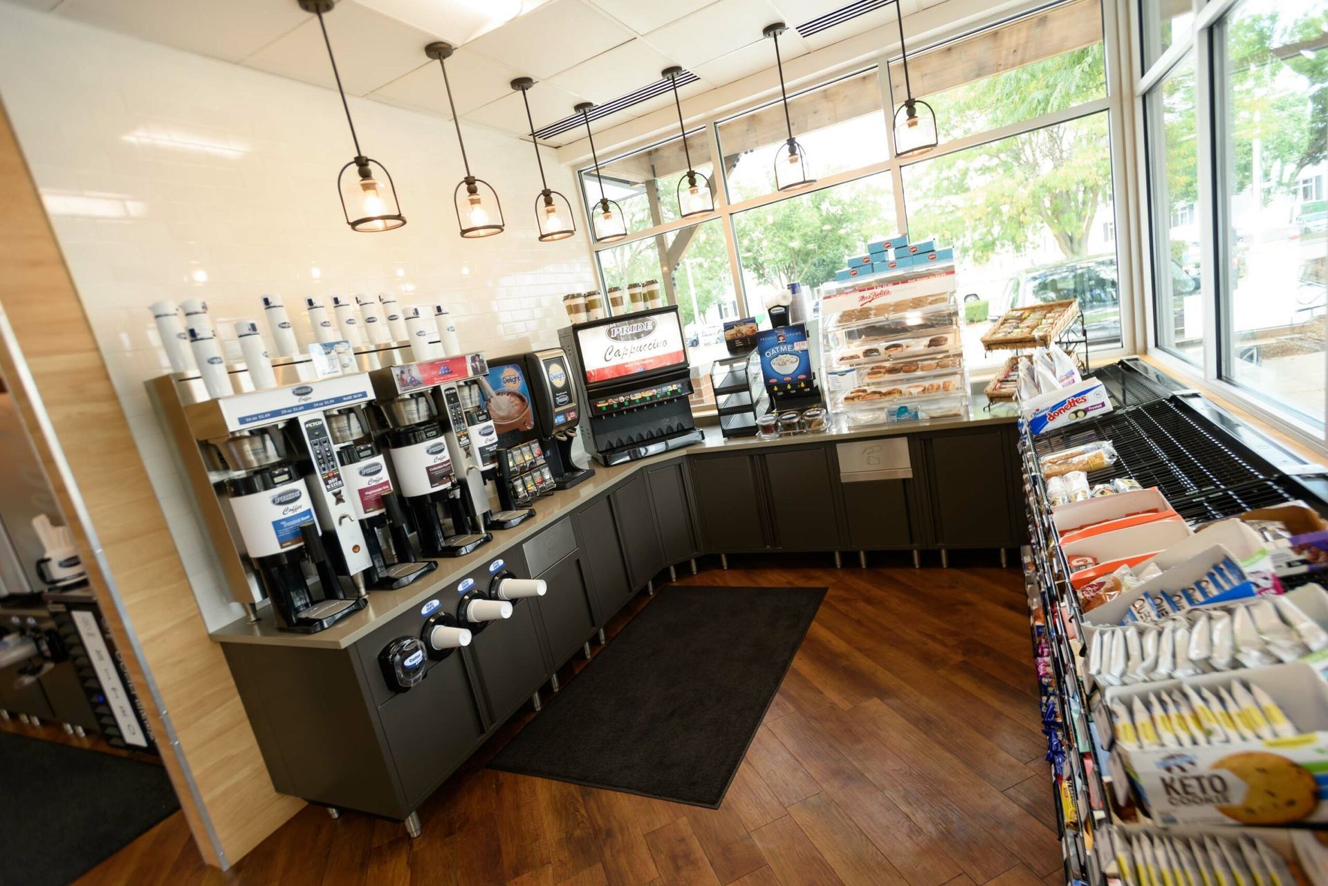 The inside of a convenience store with a lot of food and drinks.