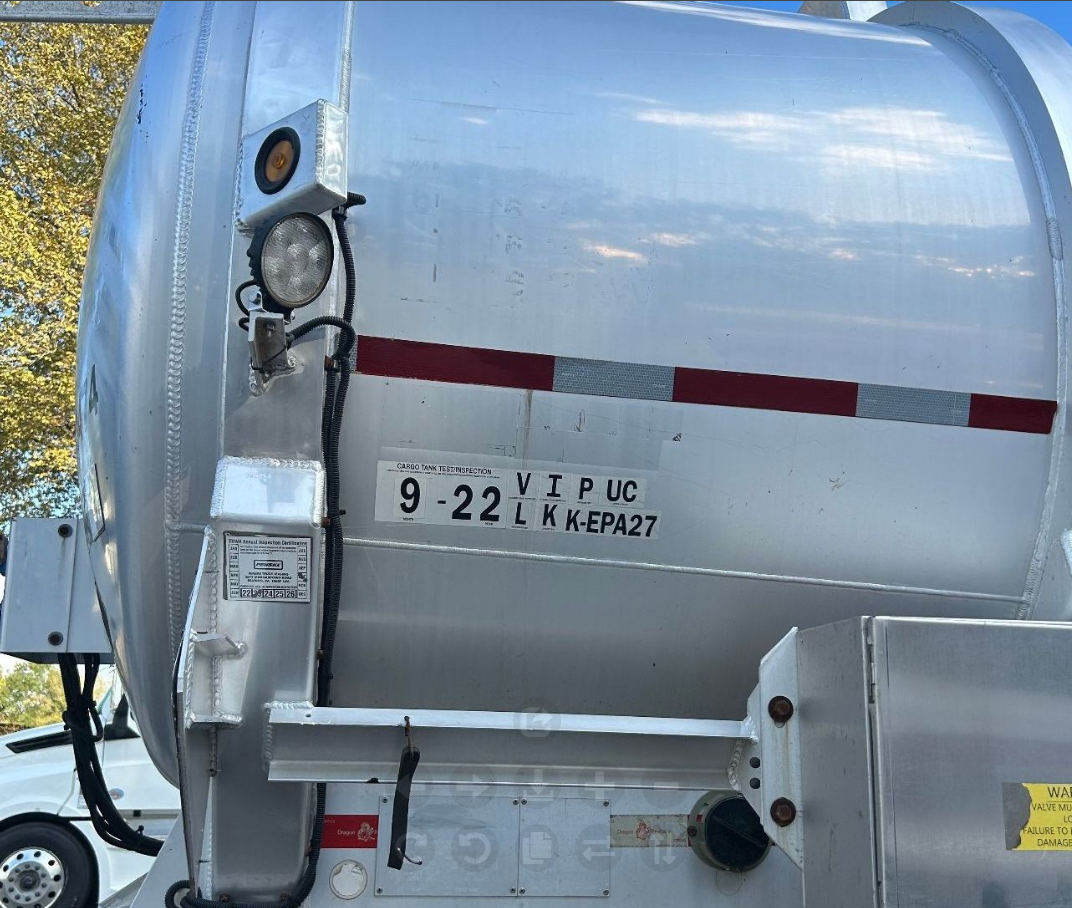 A silver truck with a license plate that says vip uc