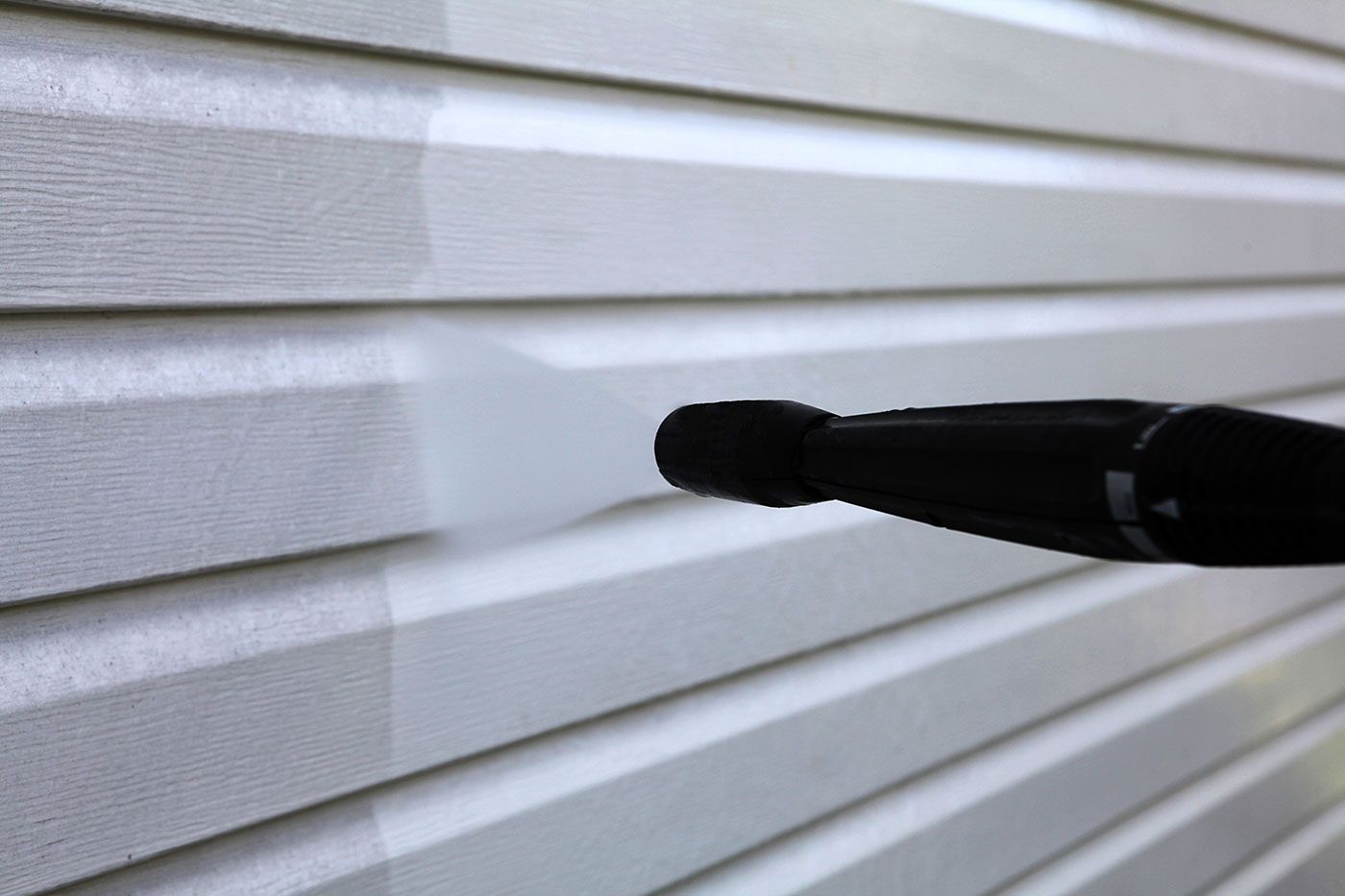 pressure washing a wall