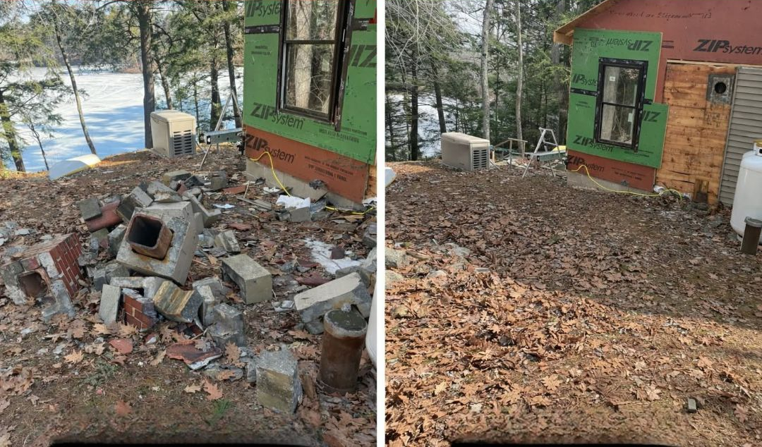Debris and broken bricks beside a green building, with a leaf-covered yard and wooded background.