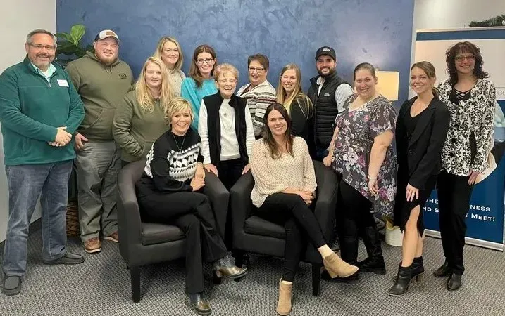 A group of people smiling