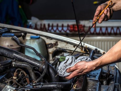 Mechanic changing oil