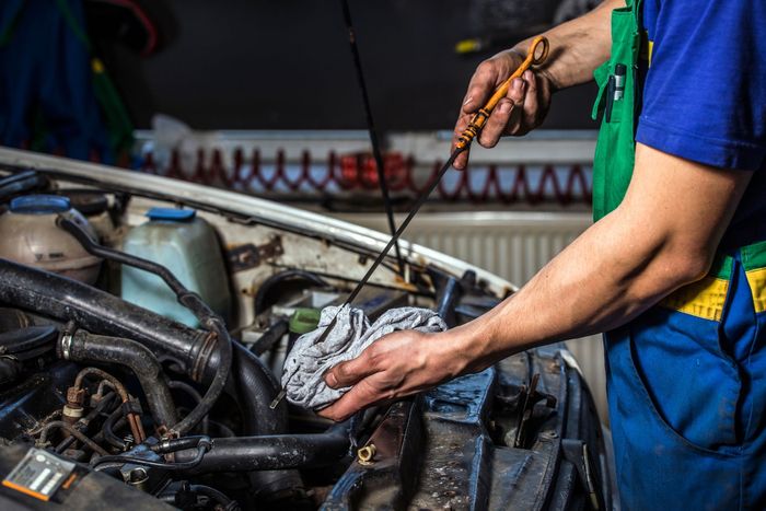 Mechanic changing oil