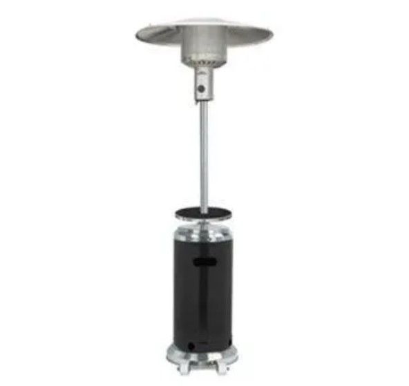 A black patio heater is sitting on a white surface.