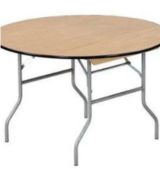 A round wooden table with metal legs on a white background.