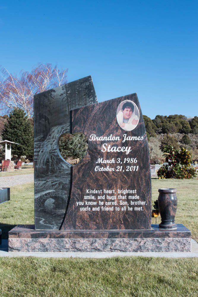 Heart-cut granite headstone for Brandon James Stacey with portrait and waterfall engraving